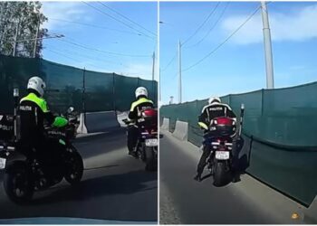 Căzătură spectaculoasă a unui polițist pe motocicletă, surprinsă de o cameră de bord
